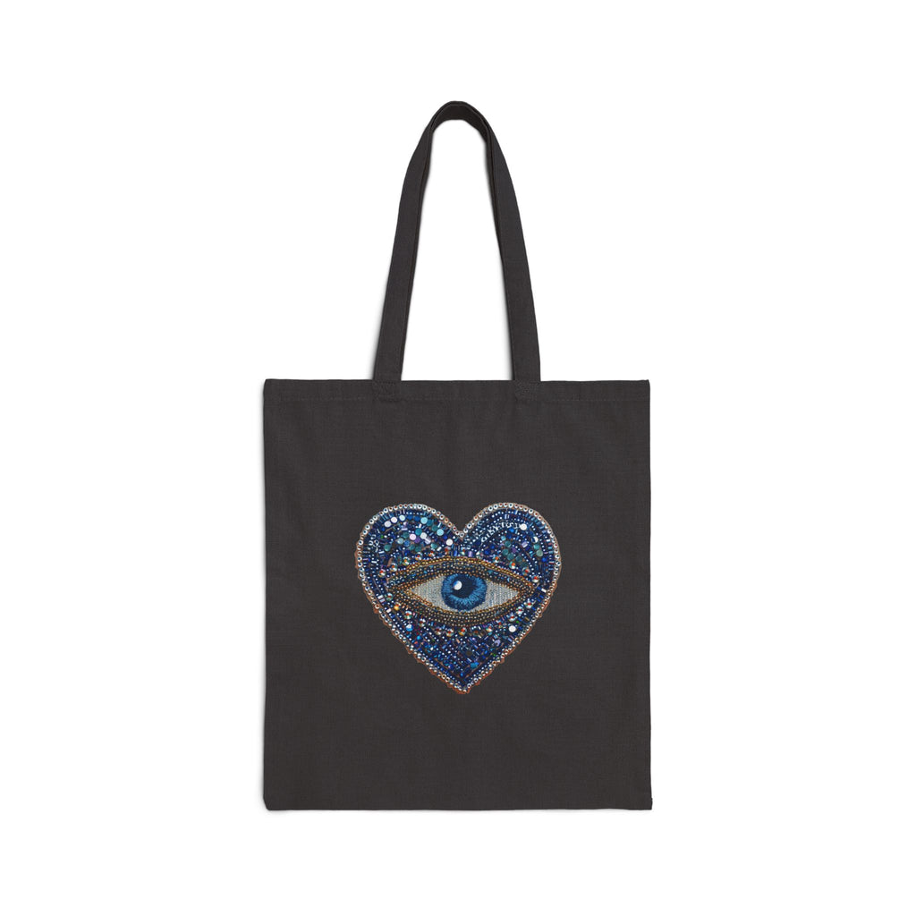Black tote bag with evil eye graphic on a white background
